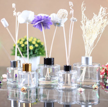 cylindrical glass incense bottle